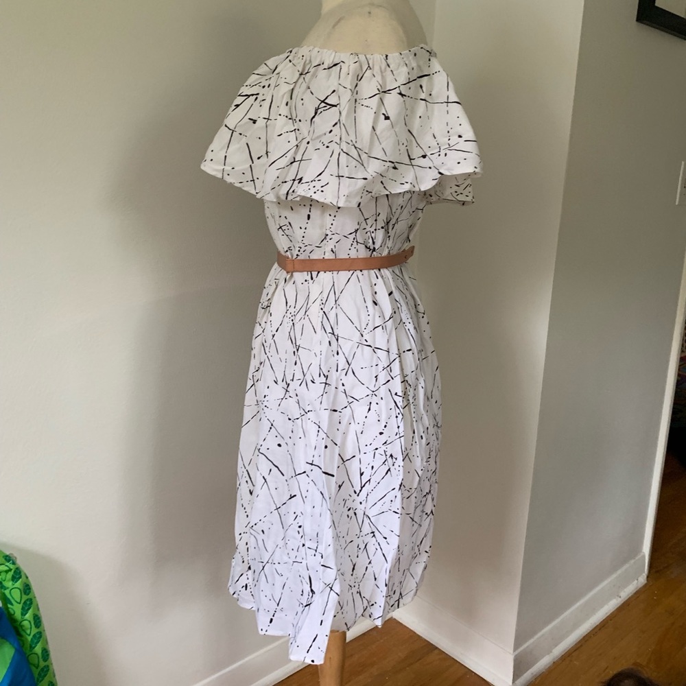 Look like a Jackson Pollack in this white dress